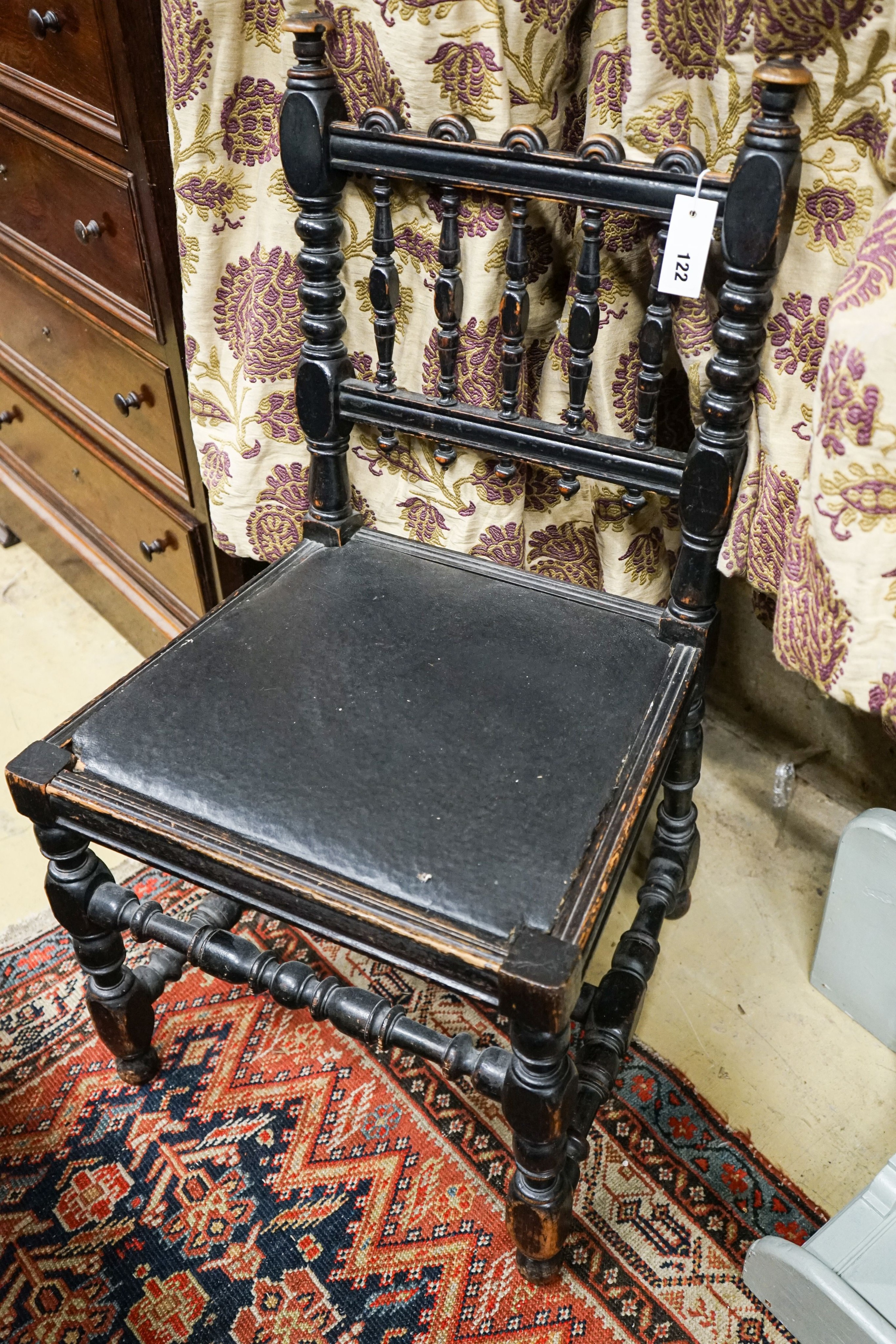 An ebonised beech chair designed by Edward Blore for Lambeth Palace. made by Gillow & Co. original oil cloth seat. Bears an ivorine plaque, 'Lambeth Palace'